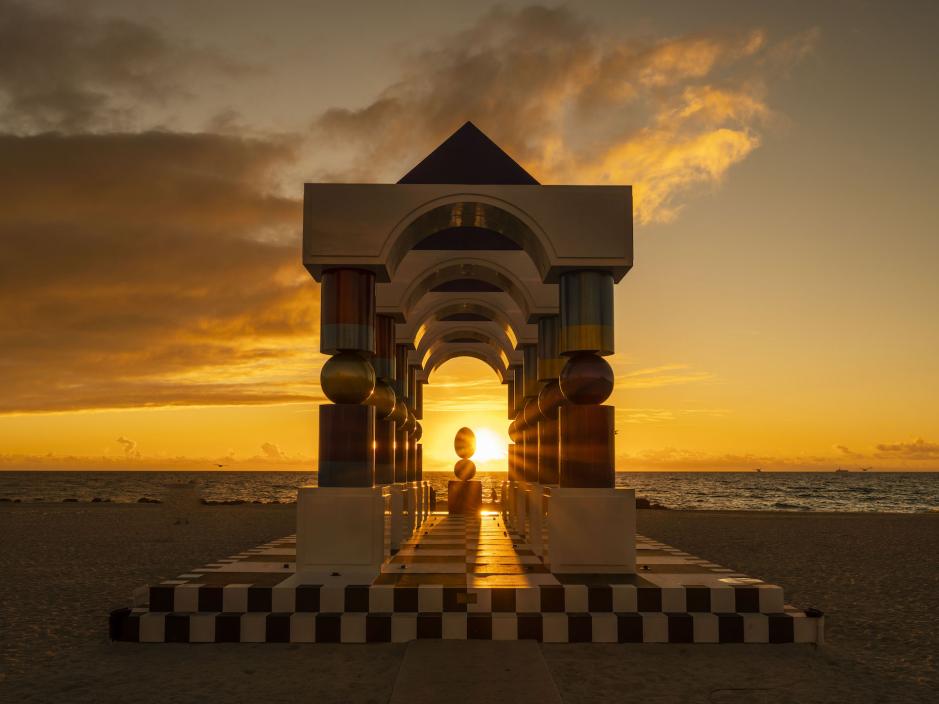 art feature on the beach with sunset in the background