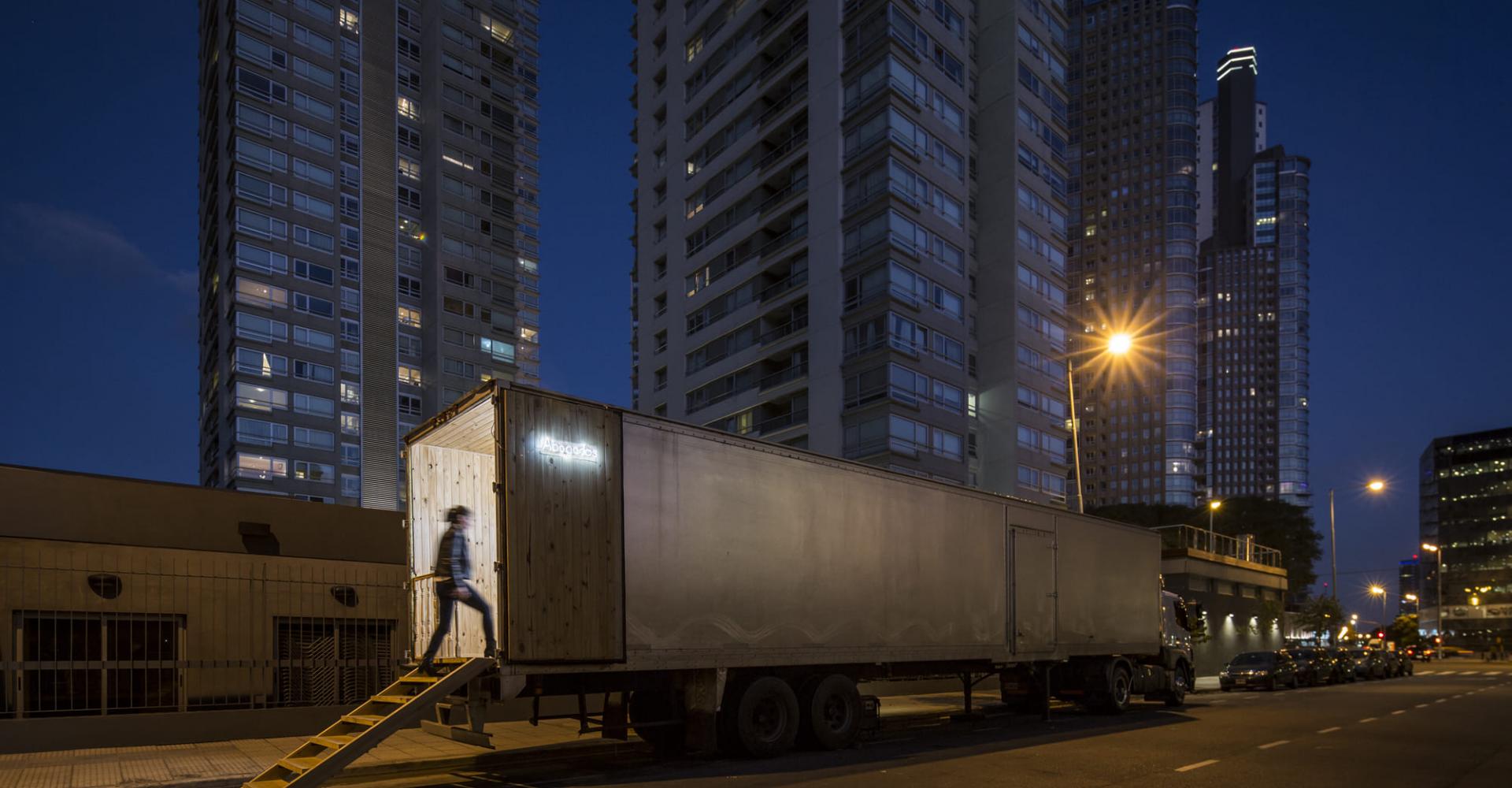 A person waling into a furnished semi truck bed 