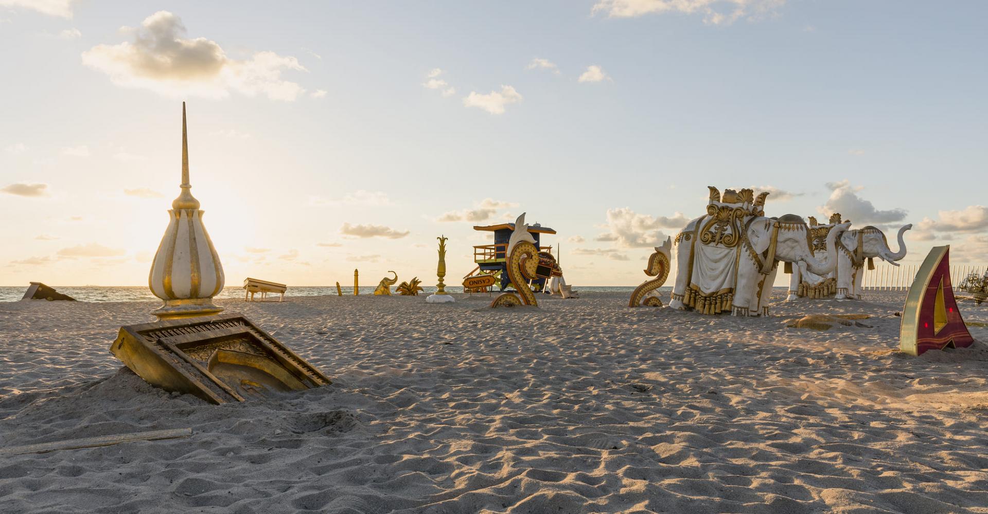 A collection of giant pieces from the abandoned Taj Mahal casino placed on the beach