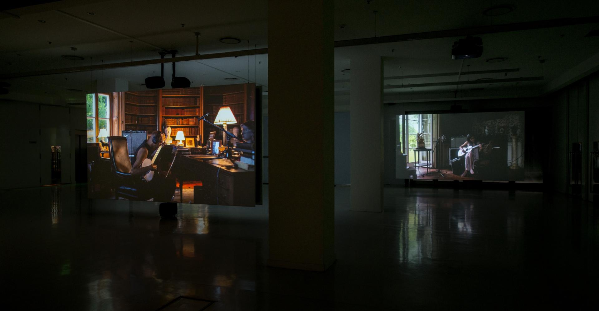 Hanging Screens with projections of musicians playing intruments